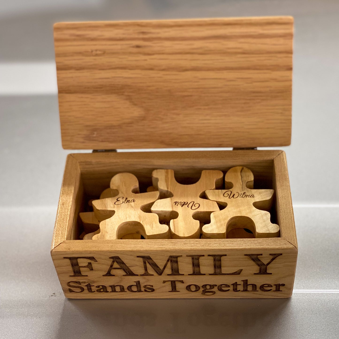 Family Stands Together stacking people with stand/display/storage box.